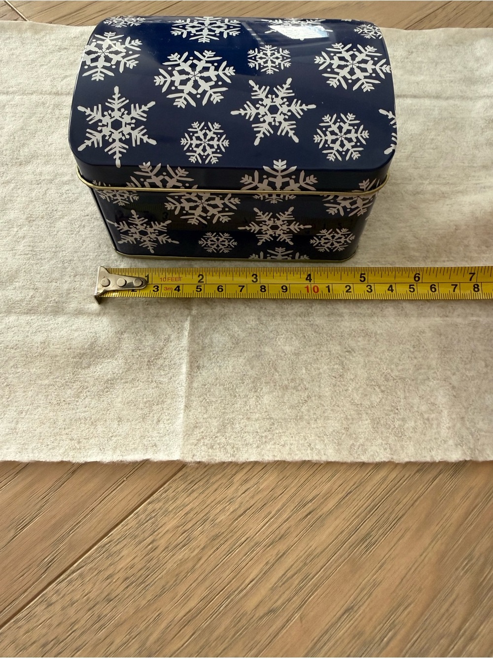 Navy Tin Storage Box with White Snowflake Pattern.Great to keep baking recipes.